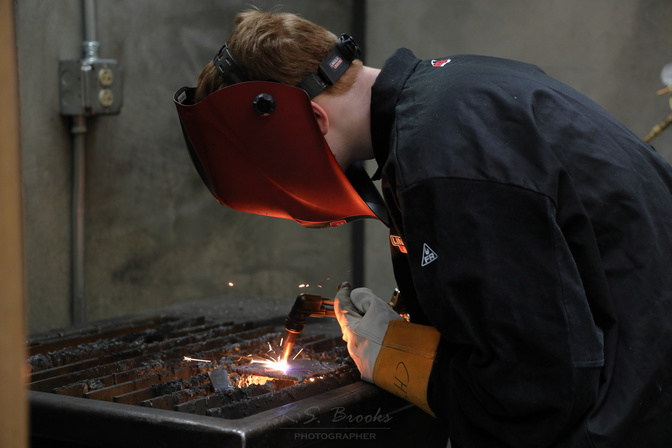 young man welding