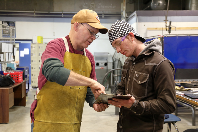 - Instructor Jerome Shoemaker with student Wyatt Friess at Chewelah’s CTE.